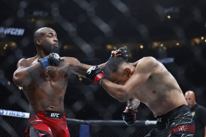 Bobby Green lands a punch on Tony Ferguson during a UFC event.